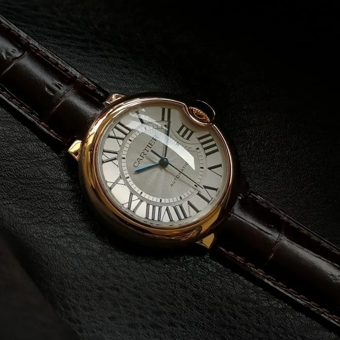 top-tier watch Cartier men's white dial blue balloon series c series leather strap watch side view