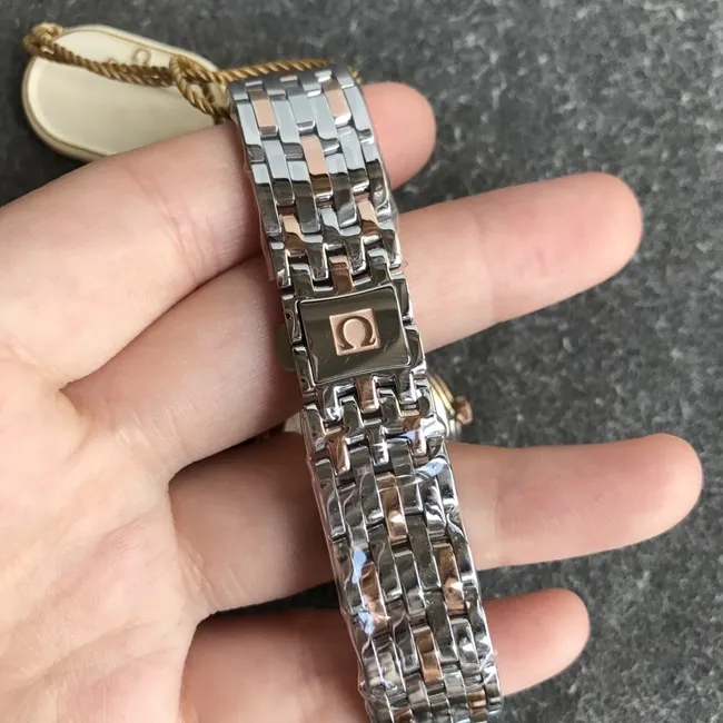 DK factory top-tier replicaOmega super a watch women's white dial gold steel bracelet natural real diamond butterfly series quartz watch front view