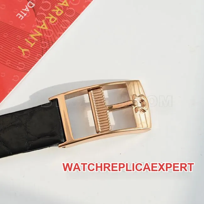 Real-life photo of the front of a top-tier Omega De Ville watch with a gray dial, quartz movement, and black leather strap