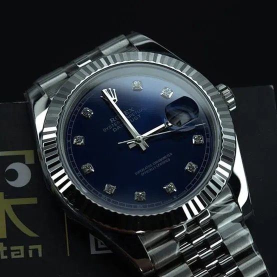 jvsRolex blue log watch tiger tooth ring front view
