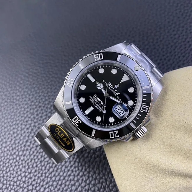 Clean factory top Rolex men's watch, black dial, steel strap, black Submariner, automatic movement, side view.