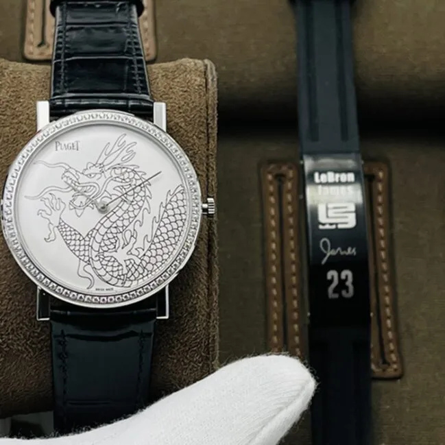 Top collectible watches Piaget Men's White Plate Black Strap Dragon and Phoenix Collection Belt Watch Front View