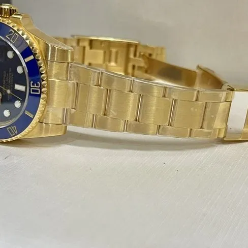 top-tier watch Rolex men's blue dial gold band blue Submariner automatic movement watch side view