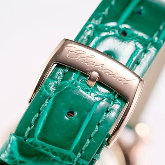 Top Chopard women's watch, black dial, green strap, HAPPY DIAMONDS series, mechanical leather strap, front view.