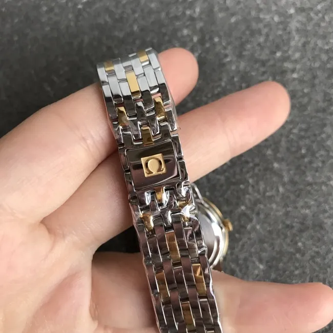 DK factory top-tier replicaOmegasuper watch women's white dial gold steel bracelet new quartz Diefei series watch front view