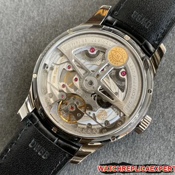 ZF FactoryIWCreplica watch Portuguese series perpetual calendar date day display month green dial moving gold needle movement picture