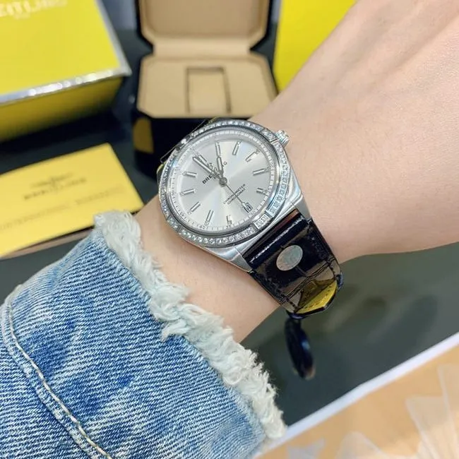 Breitlingtop-tier watch Nanhai capsule series fully automatic movementleather strap women's white dial black belt front view