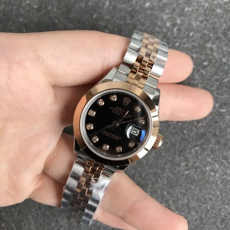 Rolex Datejust 28mm mechanical watch, fluted bezel, rose gold, black dial, diamond hour markers, front view