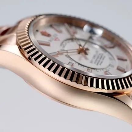 Top Rolex men's watch, white dial, rose gold, with the Explorer II series mechanical watch, front view.