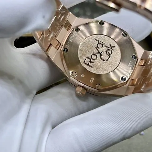 top-tier watch Audemars Piguet men's white dial gold band Royal Oak automatic movement watch front view